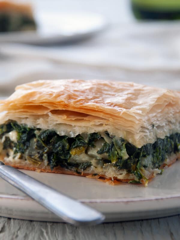 Close up from the side of a piece of spanakopita.