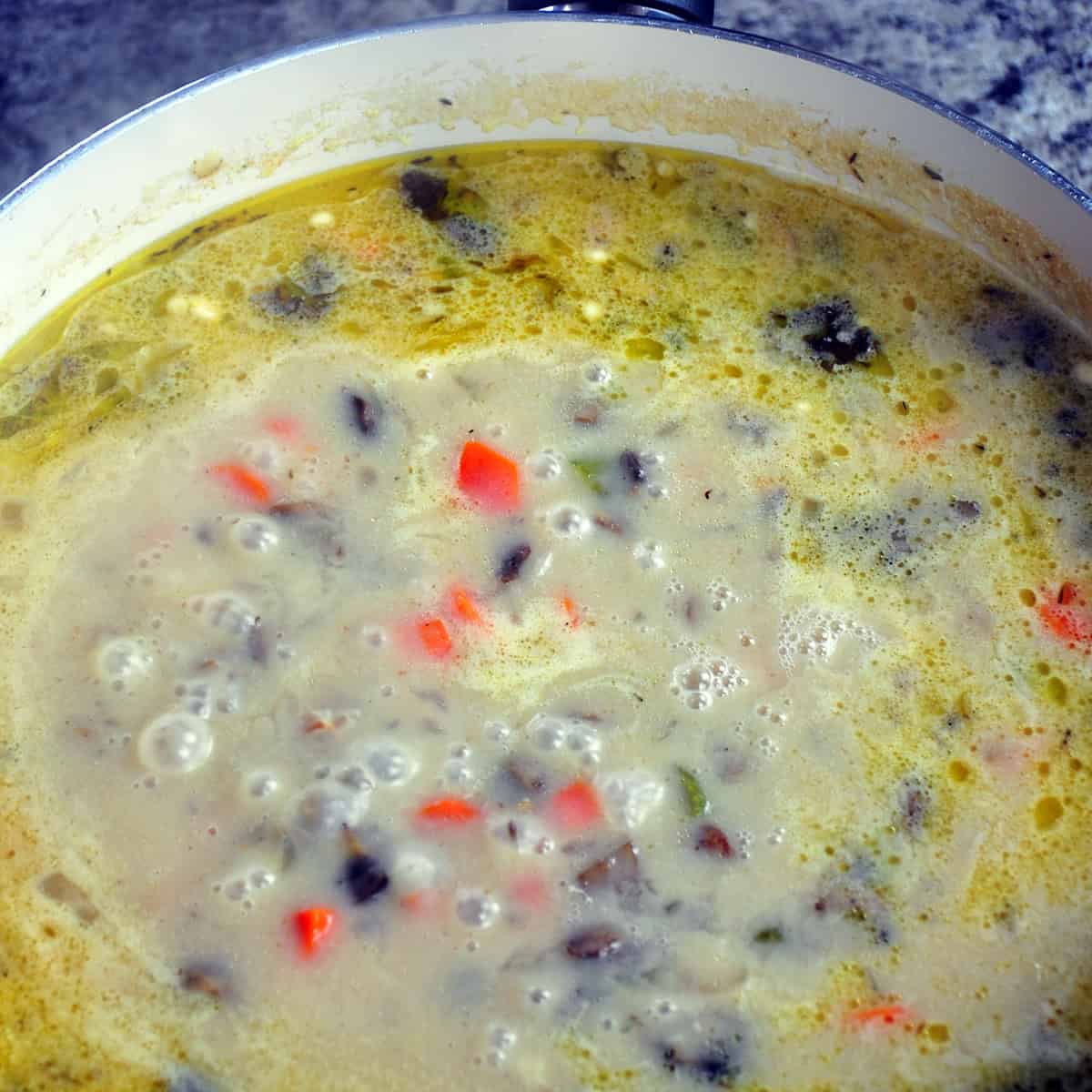 Close up of fricassee sauce thickening.