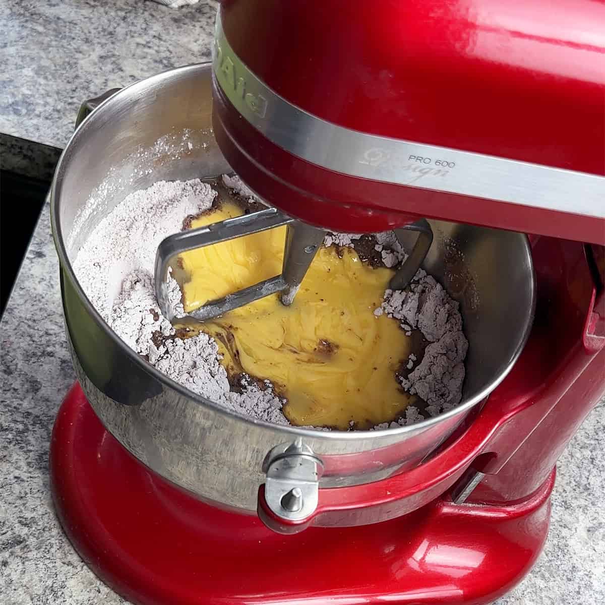 Mixing Wet and Dry Adding wet ingredients to dry ingredients.