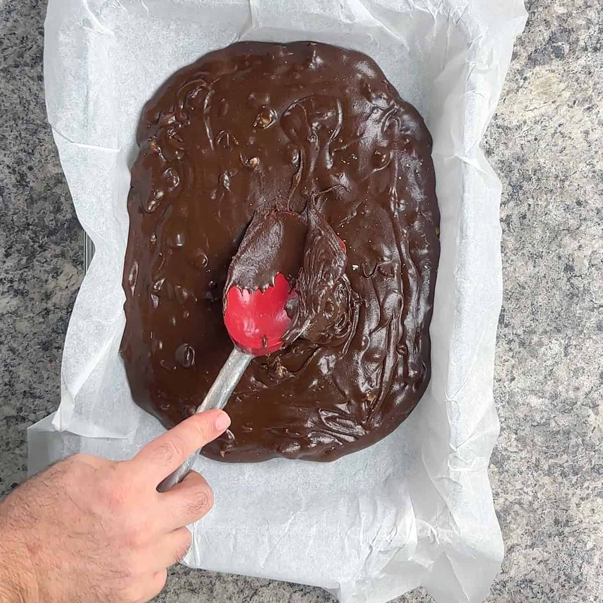 Spreading Fudge Spreading the Velveeta fudge in the dish.
