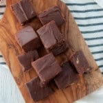 Several pieces of Velveeta fudge on a cutting board.